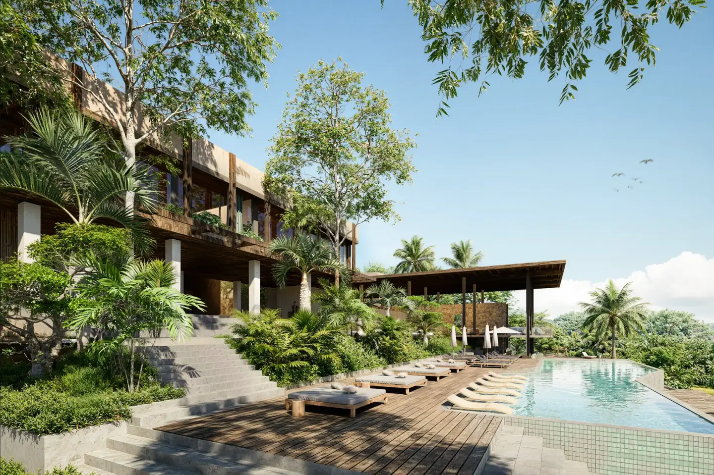 Poolside deck with sun loungers beside the House of 22 residences